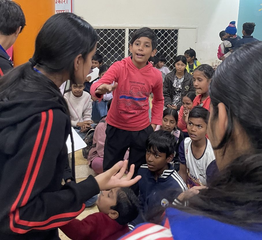 Facilitating a discussion with children during a civic-awareness workshop