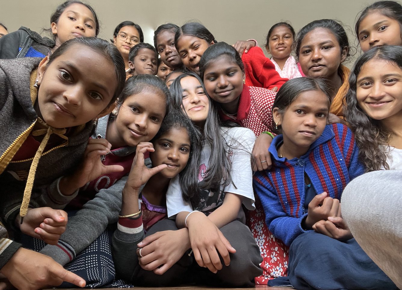 Posing close together with a group of girls after a workshop