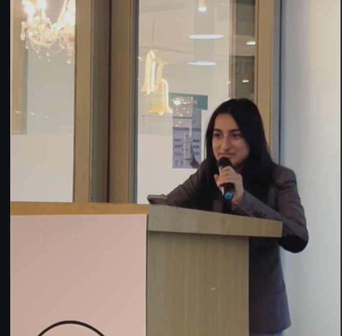 Speaking at the podium at Debaters of India WSDC 2025