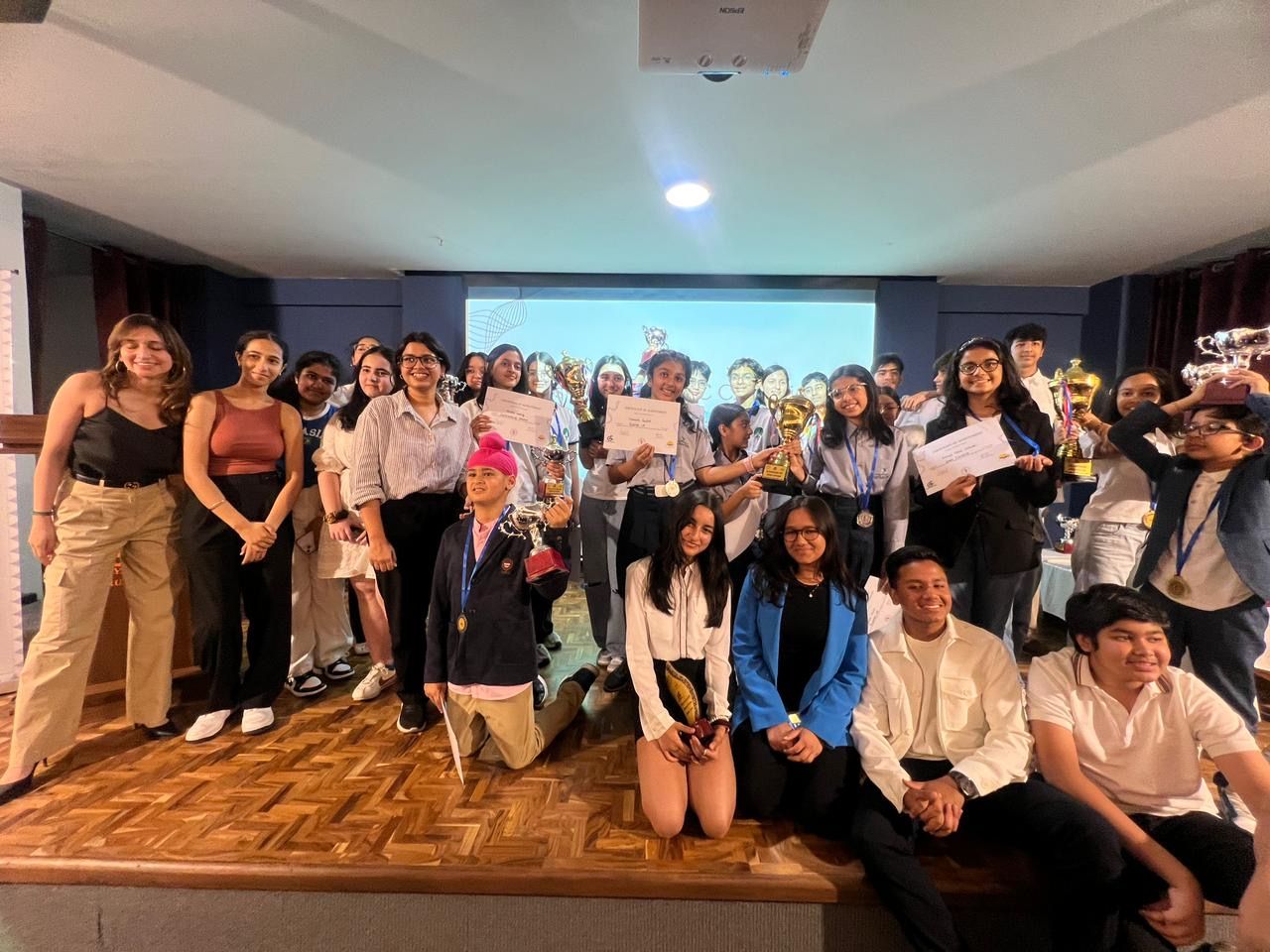 Winners and organizers with trophies at the Debaters of India WSDC Championship, 2024